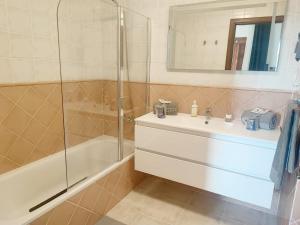 a bathroom with a sink and a shower at Villa Petra in Tuineje