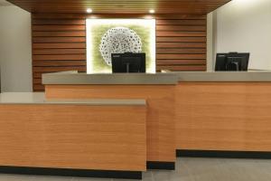 a reception desk in a hospital with a picture on the wall at Fairfield Inn & Suites by Marriott Moorpark Ventura County in Moorpark +28 photos
