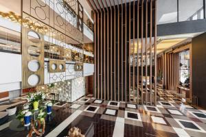 Un restaurant u otro lugar para comer en Four Points by Sheraton Doha