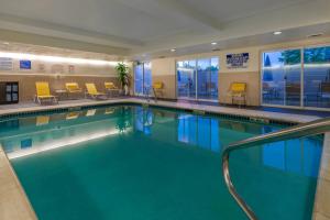 a large swimming pool in a hotel room at Fairfield Inn Salt Lake City South in Murray