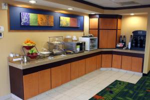 a kitchen with a counter with fruit on it at Fairfield Inn and Suites by Marriott Marion in Marion