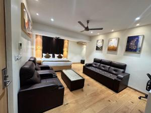 a large living room with a bed and a couch at HOTEL TOUCHWOOD in Visakhapatnam