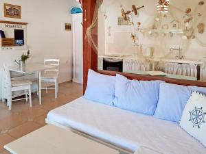 a living room with a couch and a table at Apartments Valic in Baška