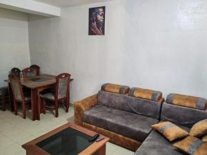 Кът за сядане в Tadagbe Appart Studio2
