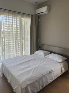 Postel nebo postele na pokoji v ubytování Sea La Vie Villa