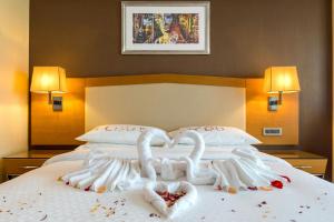 Ένα ή περισσότερα κρεβάτια σε δωμάτιο στο Four Points by Sheraton Ikot Ekpene