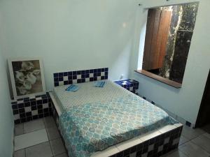 Ένα ή περισσότερα κρεβάτια σε δωμάτιο στο Beach Hostel do João