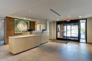 a lobby with a reception desk in a building at Fairfield Inn & Suites Southport in Southport +40 photos