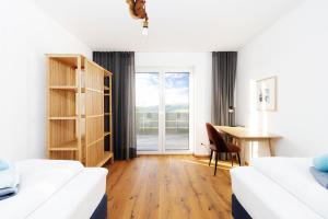 Postel nebo postele na pokoji v ubytování HEIMATEL - Bodensee Residenz Allgäu