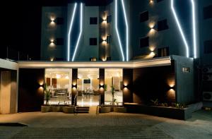 a building with lights on it at night at Ritz Hotel Juba in Juba