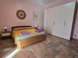 A bed or beds in a room at Cuscino & Cappuccino
