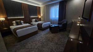 Postel nebo postele na pokoji v ubytování E Hotel