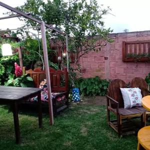 Κήπος έξω από το Casa confortável - 15min da praia +8 φωτογραφίες