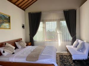 Dira Bungalows客房内的一张或多张床位