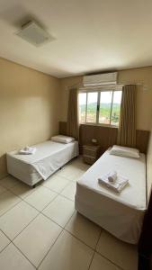 Postel nebo postele na pokoji v ubytování Planeta Hotel