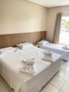 Postel nebo postele na pokoji v ubytování Planeta Hotel