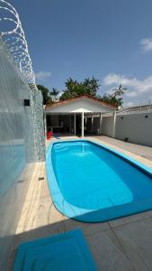 Bazén v ubytování espaço R&H nebo v jeho okolí