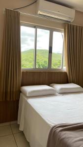 Postel nebo postele na pokoji v ubytování Planeta Hotel