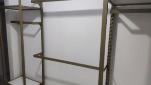a book shelf with a ladder on it at House beach da Nay in Pontal do Paraná