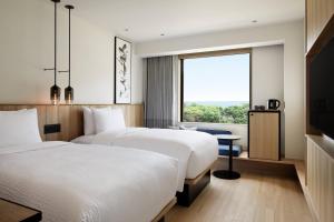 Postel nebo postele na pokoji v ubytování Fairfield by Marriott Mie Kumano Kodo Mihama