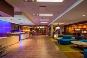 a lobby of a hospital with couches and tables at Fairfield Inn & Suites by Marriott Pittsburgh North/McCandless Crossing in McCandless Township +23 photos