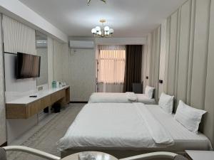 Aram Hotel客房内的一张或多张床位
