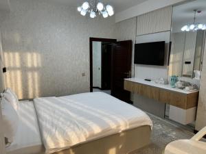 Aram Hotel客房内的一张或多张床位