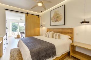 a bedroom with a large bed and a table at El Tigre Golf Retreat, Condominios Taheima in Nuevo Vallarta  +51 photos