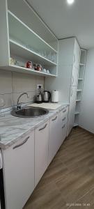 a kitchen with a sink and a counter top at Bella vista Šumarice in Kragujevac