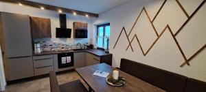 Kuchyň nebo kuchyňský kout v ubytování Appartements Moser