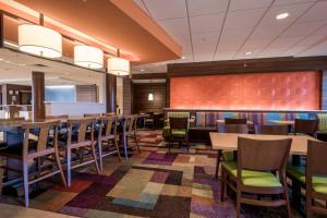 a dining room with wooden tables and chairs at Fairfield Inn & Suites by Marriott Atmore in Atmore
