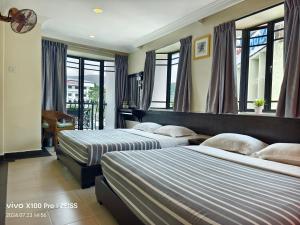 Postel nebo postele na pokoji v ubytování Hong Kong Hotel