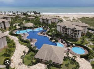 an aerial view of a resort with a swimming pool at VG Sun Cumbuco by TP Flats in Cumbuco +14 photos