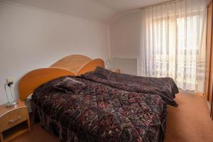 Postel nebo postele na pokoji v ubytování Vila Alexandros