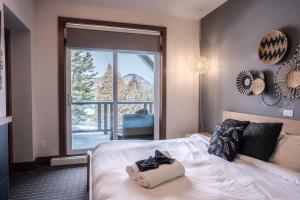 Ένα ή περισσότερα κρεβάτια σε δωμάτιο στο Suite with mountains view & Resort access