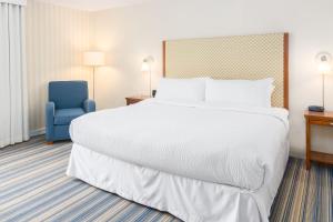 Rúm í herbergi á Four Points by Sheraton Eastham Cape Cod