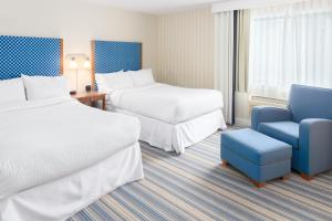 Rúm í herbergi á Four Points by Sheraton Eastham Cape Cod