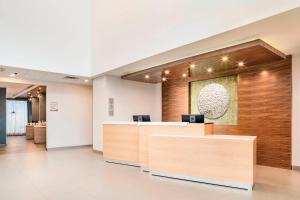 an office lobby with a reception desk and a counter at Fairfield Inn & Suites by Marriott Tijuana in Tijuana