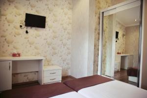 Postel nebo postele na pokoji v ubytování Rondo Hotel