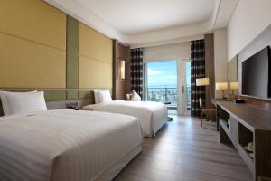 Ліжко або ліжка в номері Four Points By Sheraton Penghu