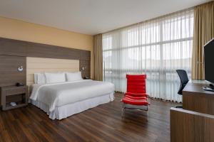 Rúm í herbergi á Four Points By Sheraton Bogota