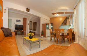 a living room with a couch and a table at Piazza Old Town Apartment in Split