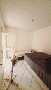a bedroom with a bed and a window at Aluguel de Verão in Torres +20 photos