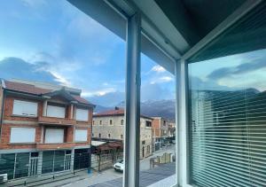 a view from a window of a city at CRooms in Peje