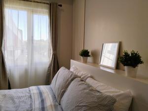 Postelja oz. postelje v sobi nastanitve APT at G-207 in SMDC Cheer Residences