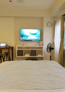 TV in/ali zabaviščno središče v nastanitvi APT at G-207 in SMDC Cheer Residences