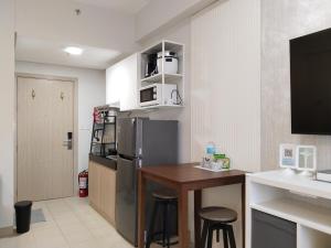 Kuchyň nebo kuchyňský kout v ubytování APT at G-207 in SMDC Cheer Residences