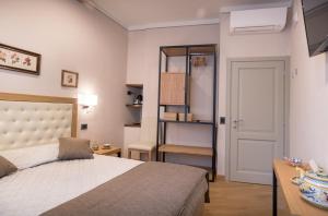 Postel nebo postele na pokoji v ubytování Brunelli B&B