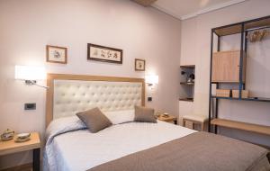 Postel nebo postele na pokoji v ubytování Brunelli B&B