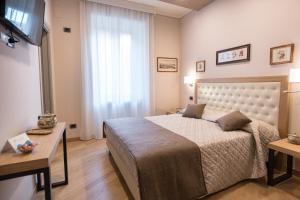 Postel nebo postele na pokoji v ubytování Brunelli B&B
